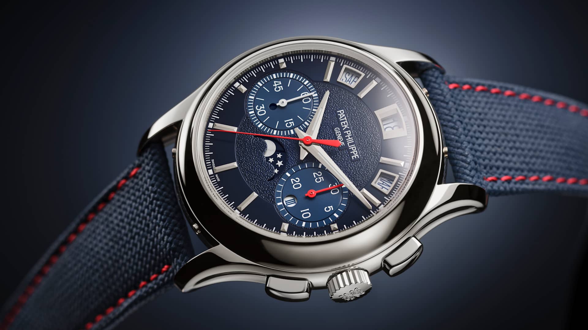 Patek Philippe 5978P-010 lacivert kadran ve kırmızı dikişli kompozit kayış